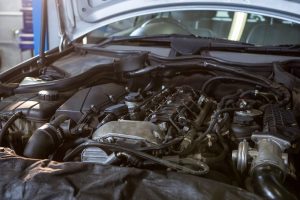 Close-up of car engine in repair garage